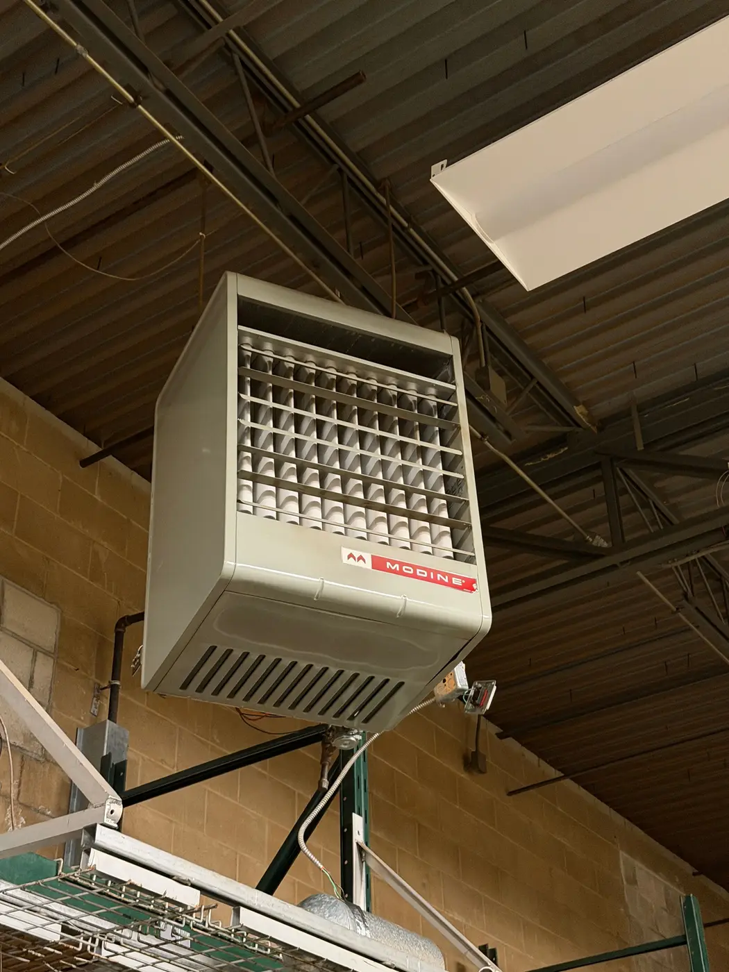 Ceiling-hung unit heater in a warehouse